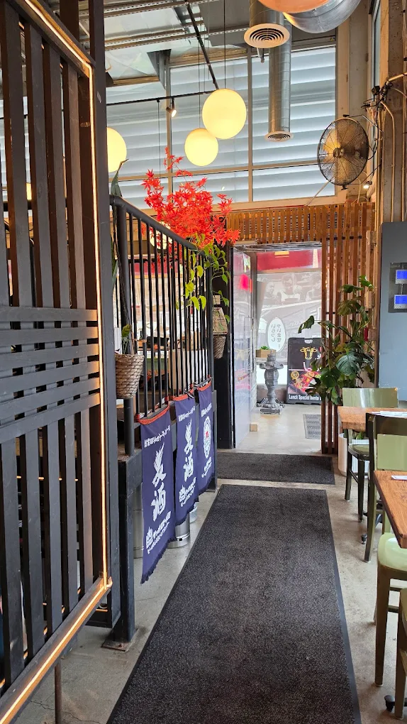 The skinny corridor in Jin Ramen, where there are also two tables for two located.